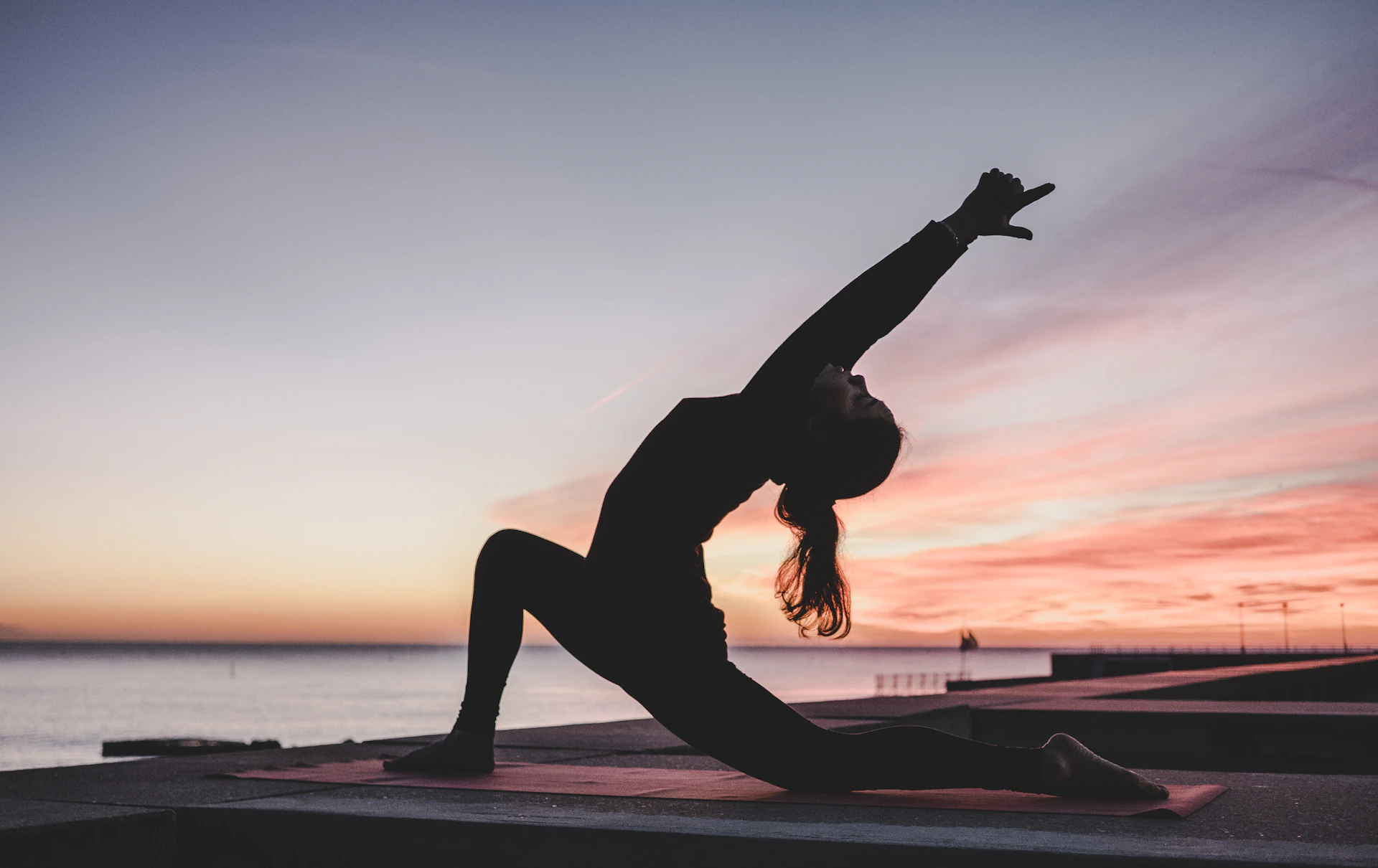 Yoga class in a calm, candlelit studio